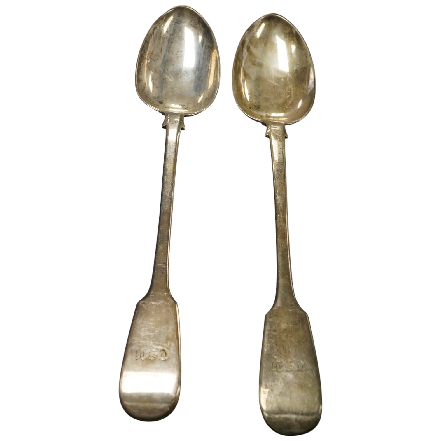 A pair of Victorian silver fiddle pattern basting spoons by Joseph & Albert Savory, London, 1846, with engraved initials, 30cm, 10oz.